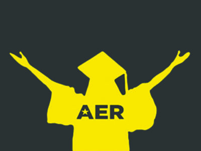 Silhouette in yellow of a person in a graduation cap with their arms outstretched.