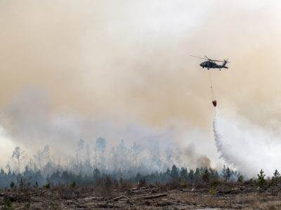 Helicopter drops water on Florida wildfire.
