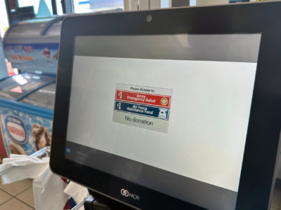 A self-checkout screen gives shoppers an options to donate to the Army and Air Force aid societies.